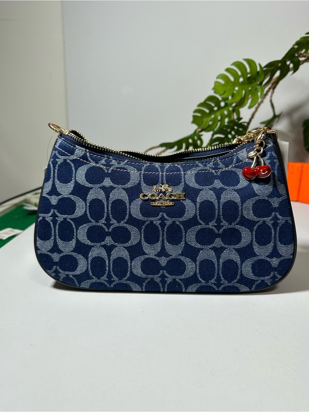 Coach Navy Signature Jacquard Mini Wristlet with Red Cherry Charm